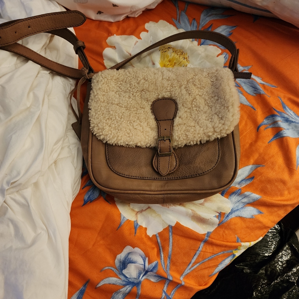 Crossbody boot barn purse.Light brown body with soft creme color top.